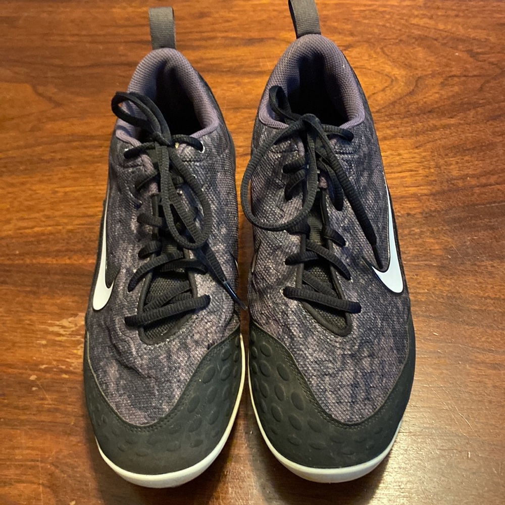 Nike cleats women’s size 9 1/2 black gray and white print design on the cleats